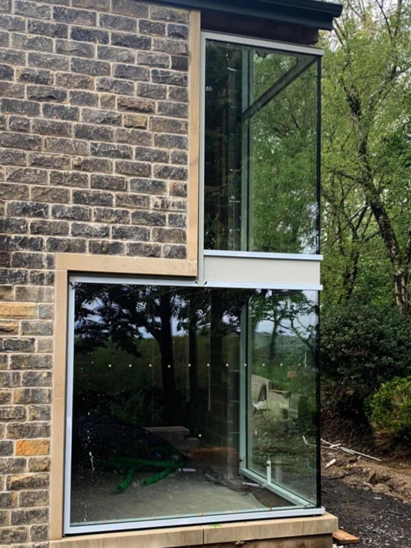 plate glass window first floor on new build construction in Bolton