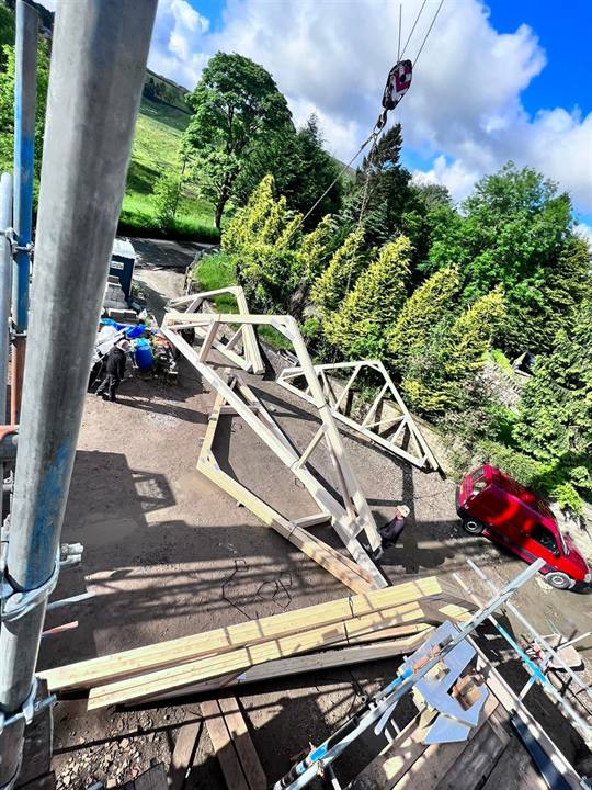 crane lifting roof trusses roofers Bolton